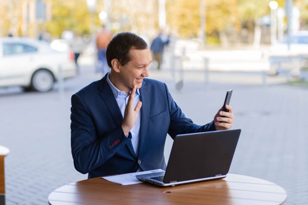 A person using Business Mobile broadband outside in open door